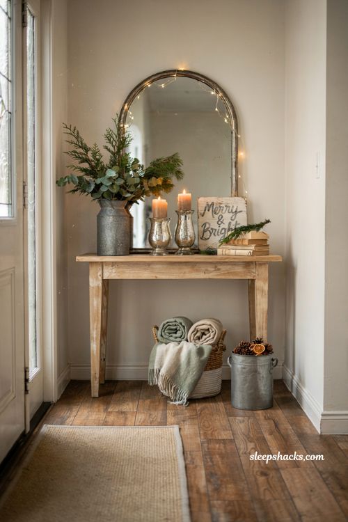Farmhouse christmas entryway decor with rustic console table holiday vignette