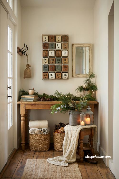 Farmhouse christmas entryway decor with rustic wooden advent calendar and cozy holiday styling