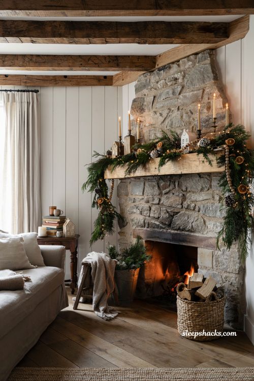 Farmhouse christmas mantel decorated with fresh greenery and snow dusted pinecones