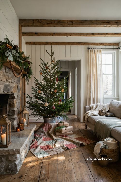 Farmhouse christmas tree with a repurposed vintage quilt used as a rustic tree skirt