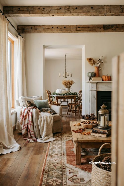 Farmhouse fall decor ideas for a cozy neutral living room with rustic autumn harvest accents
