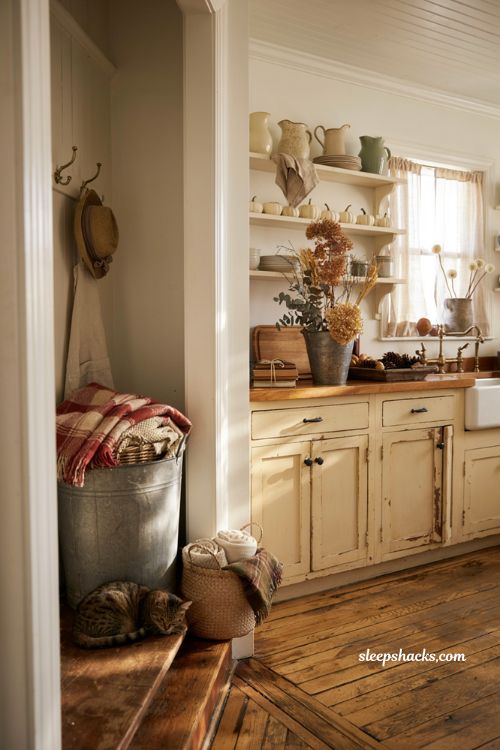 Farmhouse fall decor ideas with galvanized bins buckets and rustic entryway storage