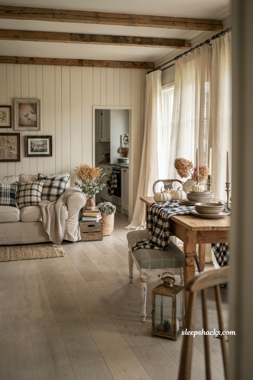 Farmhouse fall decor ideas with layered plaid textiles cozy living room and rustic autumn accents
