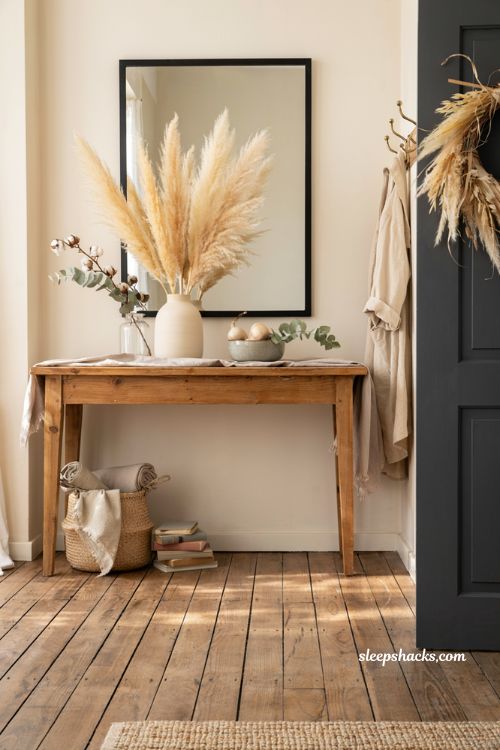 Farmhouse fall decor ideas with pampas grass wreath and elegant neutral entryway styling