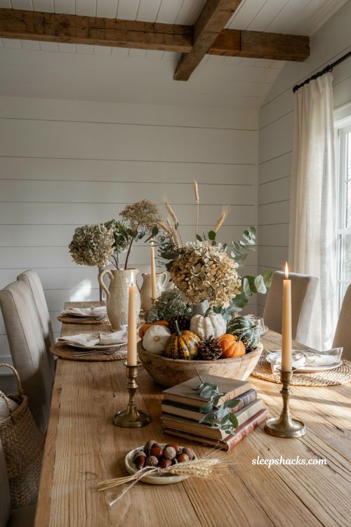 Farmhouse fall dough bowl centerpiece ideas with pumpkins gourds and rustic harvest decor