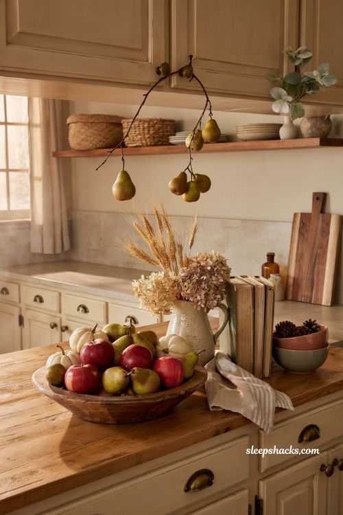 Farmhouse fall kitchen decor ideas with apples pears pumpkins and rustic harvest styling