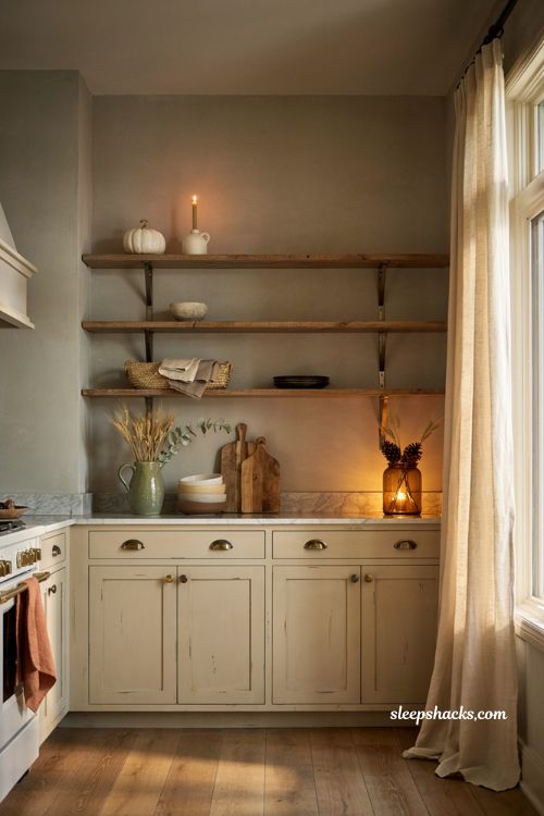 Farmhouse fall open shelf decor ideas with pumpkins candles and rustic kitchen styling