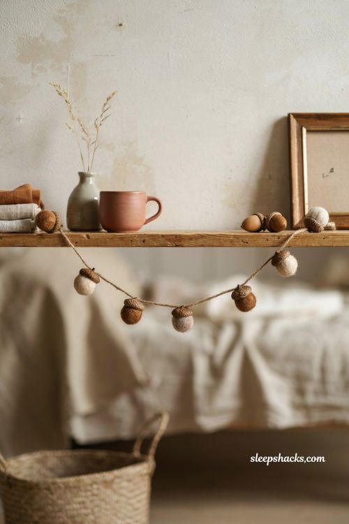 Felt acorn fall garland in neutral colors for cozy bedroom decor
