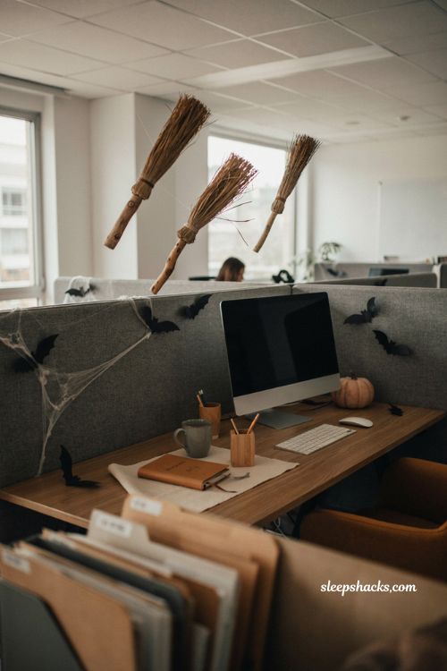 Floating broomsticks for whimsical office Halloween decorations