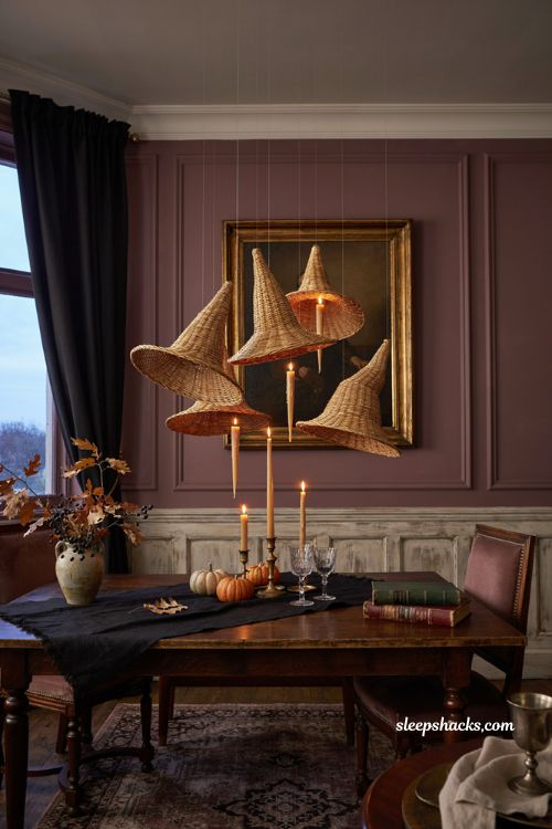 Floating witch hats and candles for elegant Halloween dining room decor