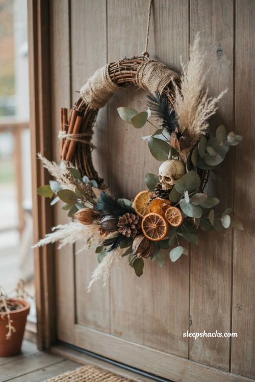 Foraged Halloween wreath with eucalyptus pampas grass cinnamon dried oranges and natural autumn decor