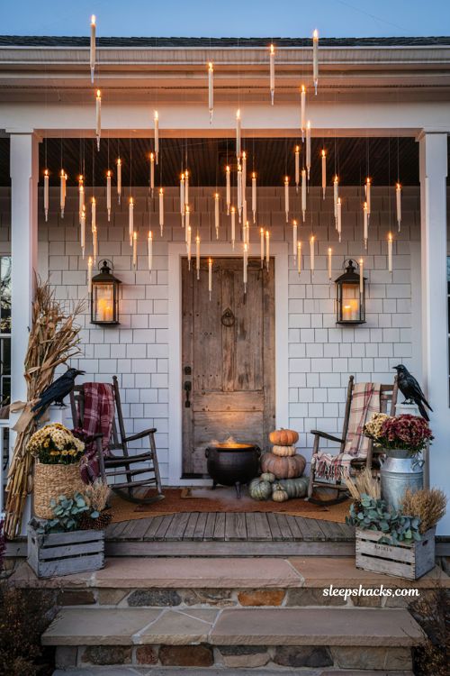 Front porch halloween ideas with floating candles and magical farmhouse decor