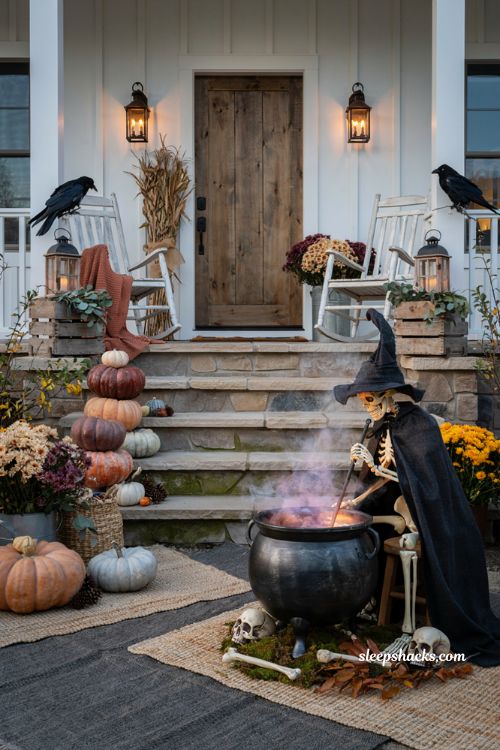 Front porch halloween ideas with glowing witch cauldron and cozy farmhouse decor
