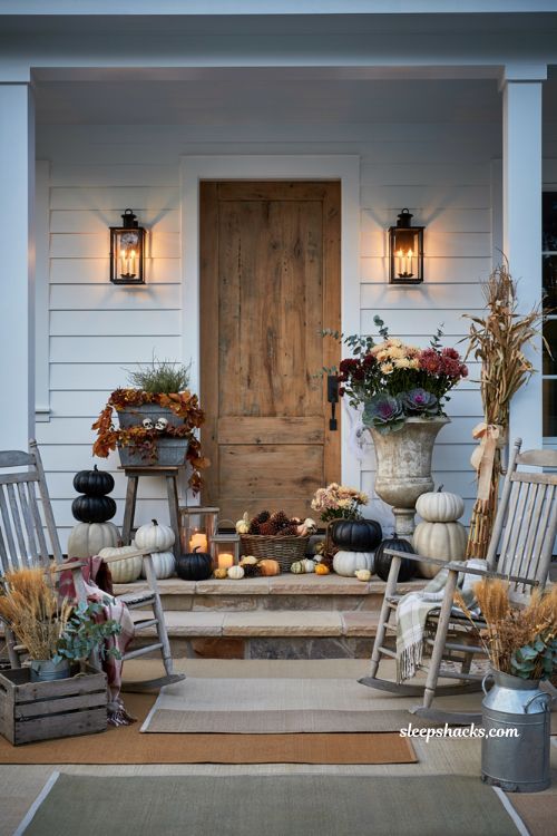 Front porch halloween ideas with tiered planters pumpkins and farmhouse decor