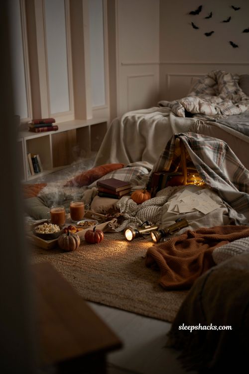 Ghost story sleepover with cozy blanket fort flashlights and fall decor 