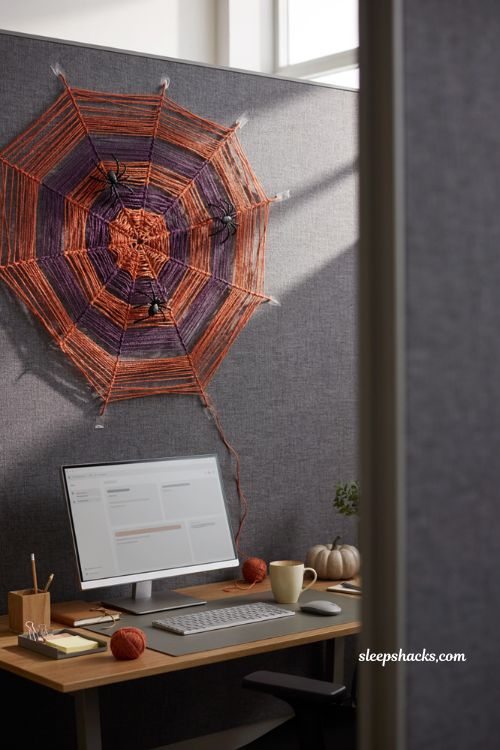 Giant yarn spider web with orange and purple yarn for office Halloween decor