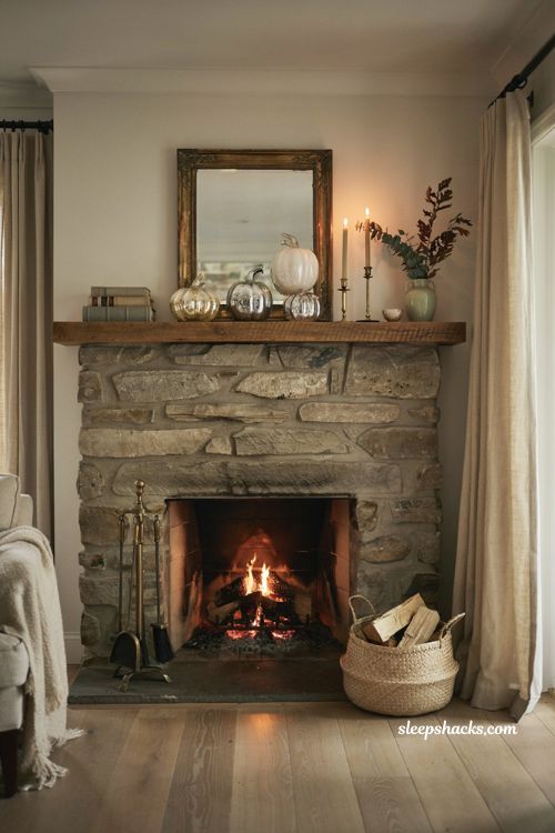 Glass pumpkin decor ideas for a cozy fireplace mantel with white and silver autumn accents