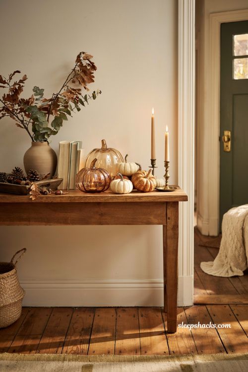 Glass pumpkin decor ideas with real pumpkins for a warm autumn entryway display