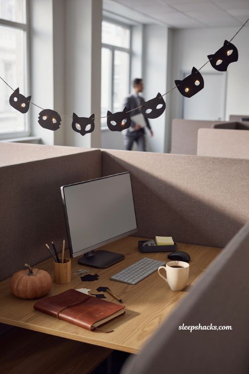 Glowing cat eye bunting with fairy lights for spooky office Halloween decor