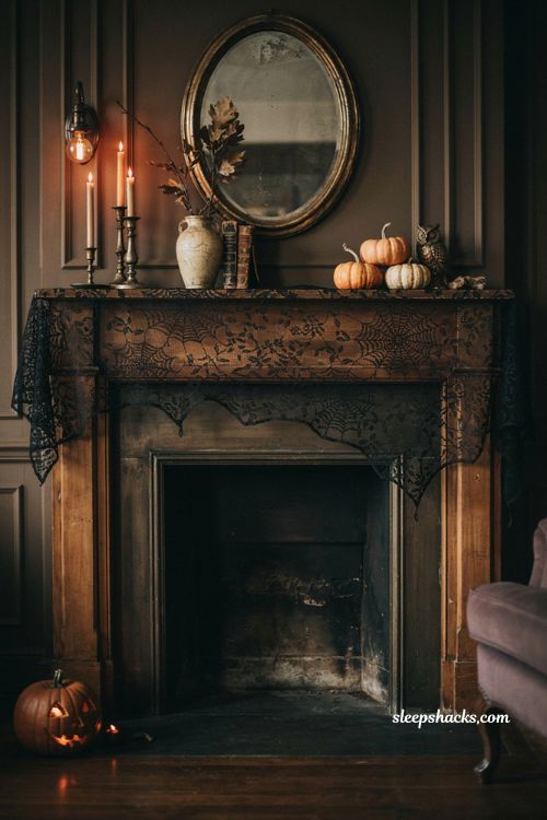 Gothic Halloween mantel with black lace spiderweb scarf and vintage decor