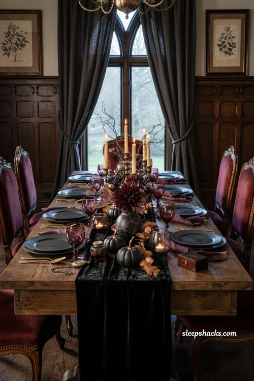 Gothic glam Halloween dining table decor with black velvet burgundy glassware and gold accents