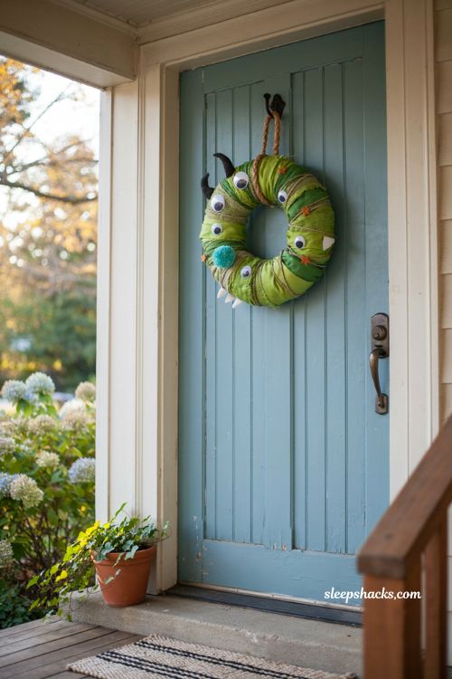 Green eyed monster wreath googly eyes kid friendly Halloween front door decor