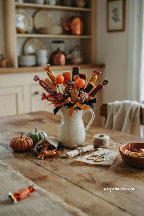 Halloween candy bouquet ideas with colorful wrapped candy and fall centerpiece