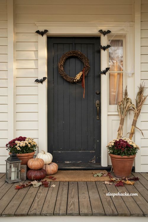 Halloween door decor with pumpkins wreath mums and rustic farmhouse accents
