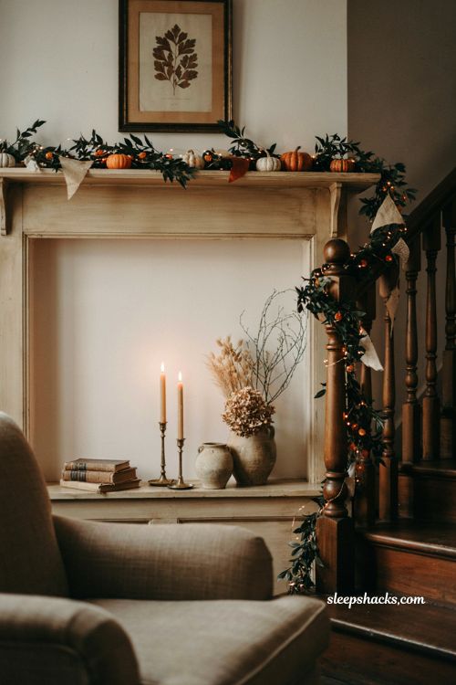 Halloween garland mantel decor with vintage orange lights and black branches 