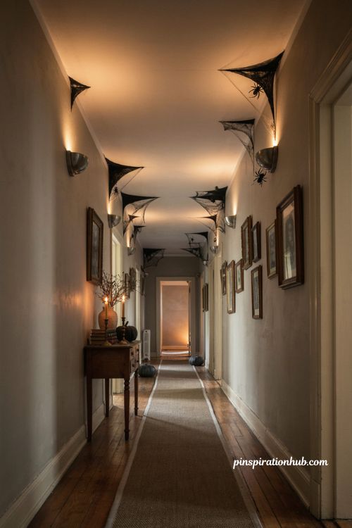 Halloween hallway ideas with black felt spiderwebs in every corner and spooky spider decor