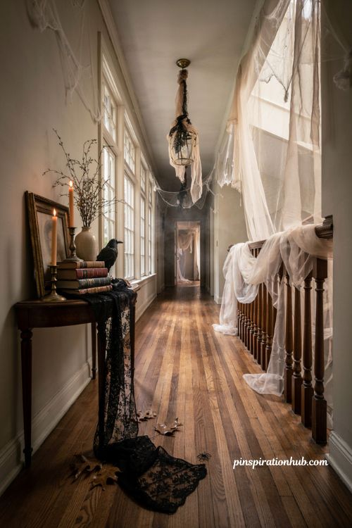 Halloween hallway ideas with black lace gauze vintage books and faded gothic decor