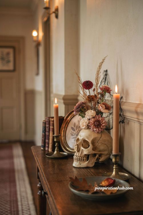Halloween hallway ideas with diy skull vase faux flowers vintage console table and gothic decor