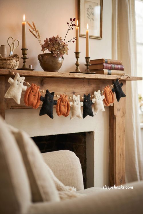 Blanket stitched felt Halloween garland with handmade ghosts pumpkins and black cats