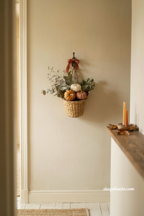 Hanging wall basket ideas with mini pumpkins faux foliage and fall entryway decor