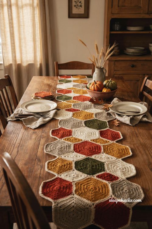 Hexagon autumn crochet table runner with colorful motifs zigzag edges and cozy fall dining table