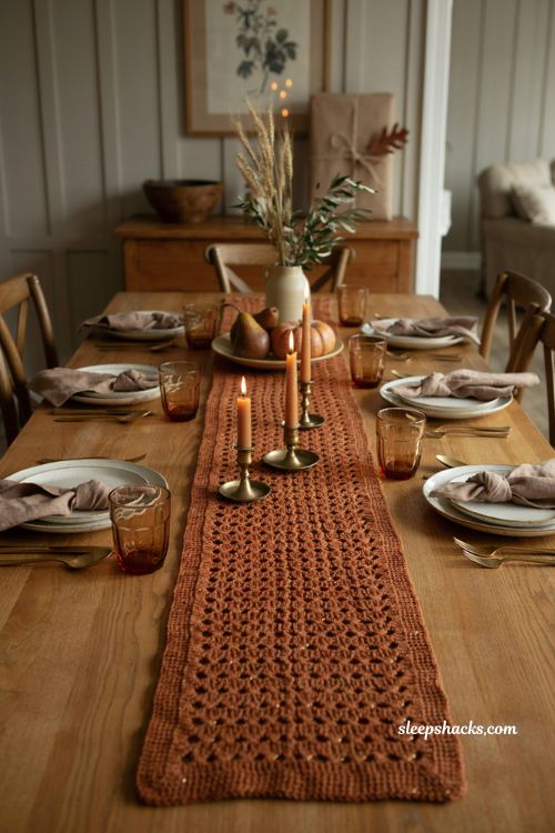 Holiday party crochet table runner with subtle gold thread warm autumn colors and elegant dining table decor
