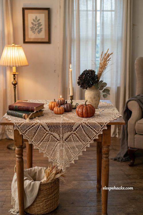 Lace spiderweb table topper Halloween decor with pumpkin candles