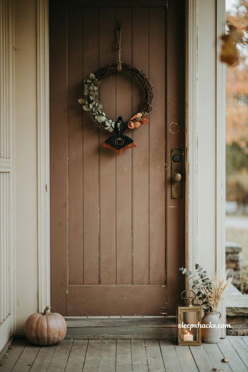 Layered Halloween door hanger with mini grapevine wreath and rustic autumn front door decor