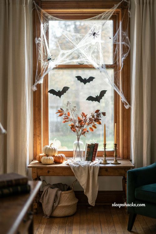 Layered cobweb corners framing a window for atmospheric Halloween decor