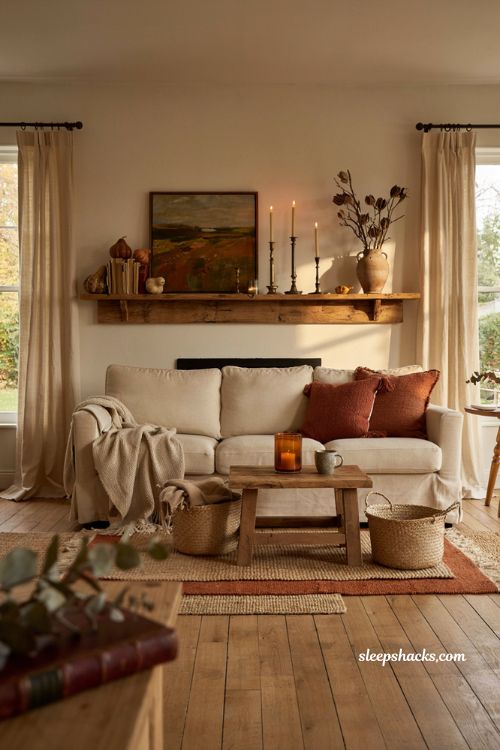 Layered fall mantel decor ideas with candles brass accents and cozy autumn styling