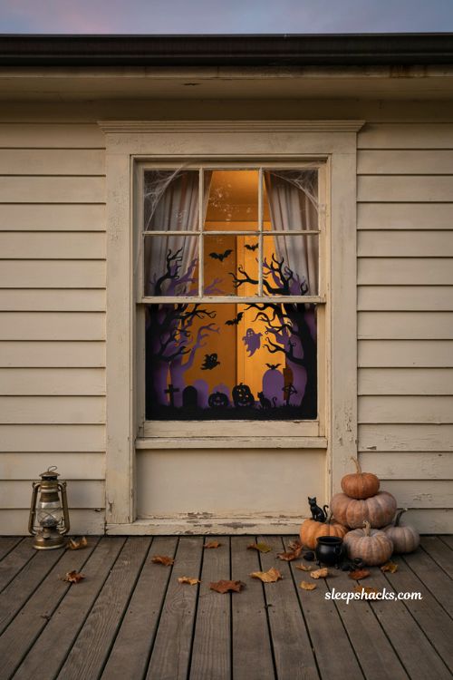 Layered two tone Halloween window silhouette with purple and black shadows 