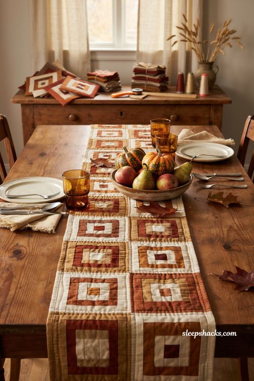 Log cabin fall table runner in rust brown and cream quilt blocks cozy farmhouse dining table