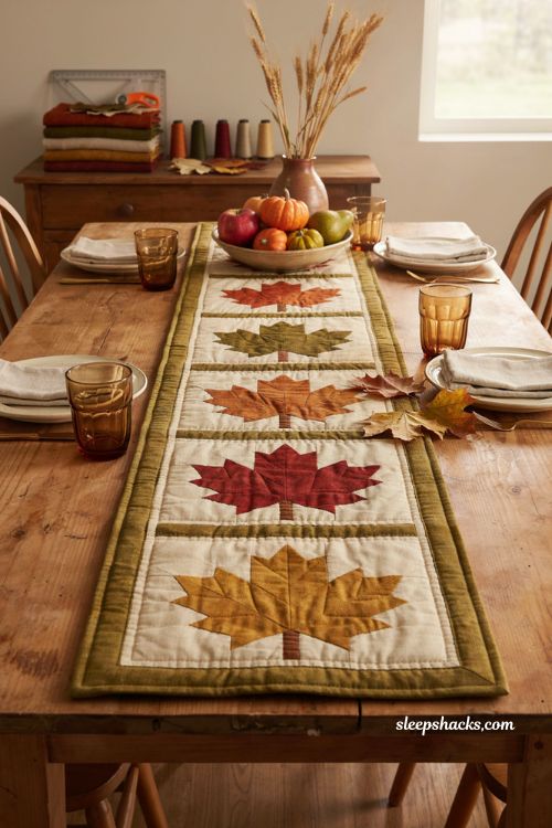 Maple leaf fall table runner with traditional quilt blocks in rust orange red and gold autumn dining table