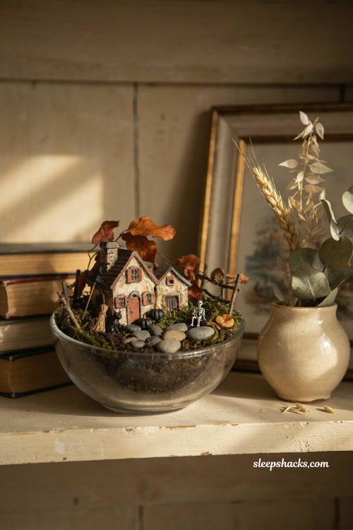 Mini Halloween fairy garden with moss and tiny houses for farmhouse decor