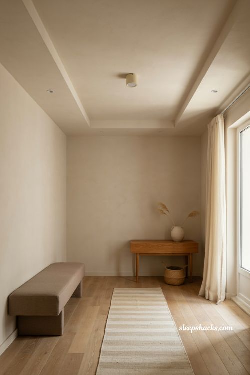 Minimal single tier fall ceiling border with recessed spotlights and small cozy hall design