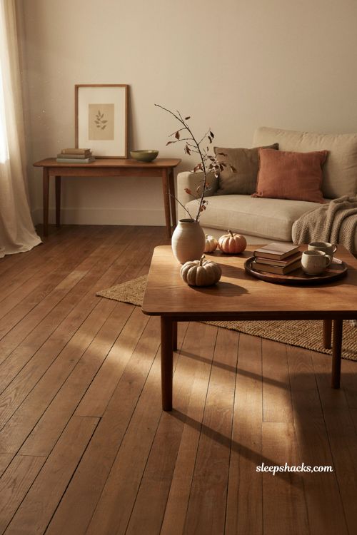 Minimalist fall decor neutral living room with natural autumn accents and cozy textures 
