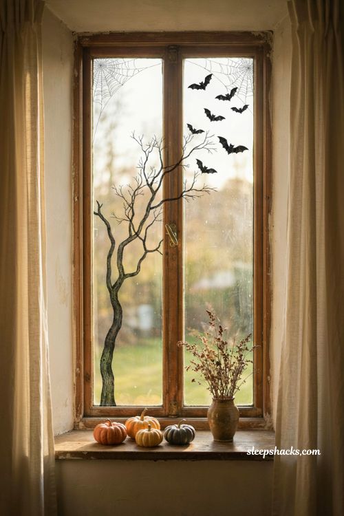 Mix and match Halloween window stickers with bats cobwebs and haunted tree silhouette