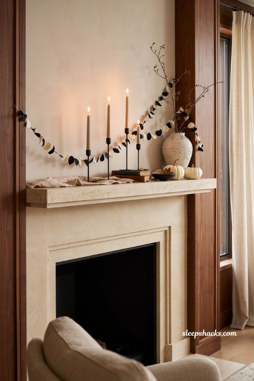 Modern Halloween mantel with handmade black and cream garland and candles
