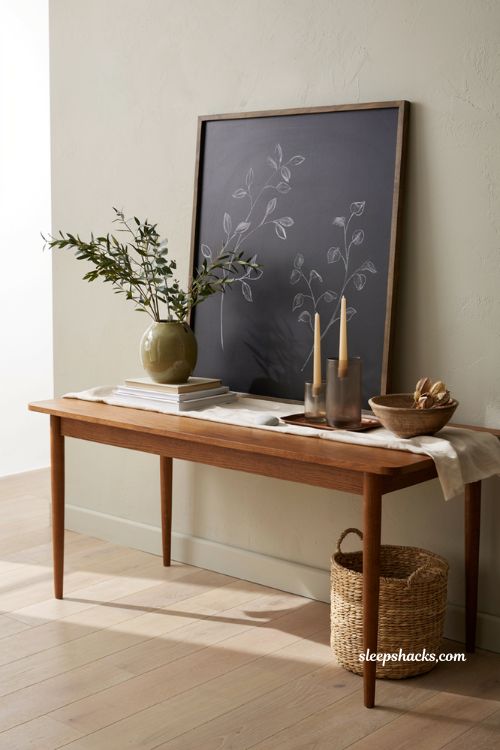 Modern fall decor ideas with a minimalist black chalkboard display in a contemporary entryway