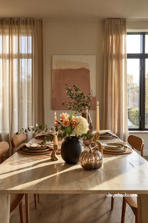 Modern fall decor ideas with a single glass pumpkin and minimalist dining centerpiece